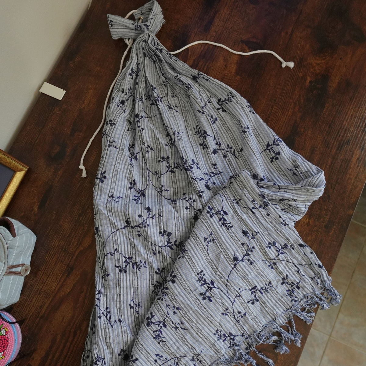 Floral-patterned dress on a wooden table